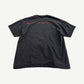 Vintage Marilyn Manson faded black tee back with red distressed band name print across shoulders.