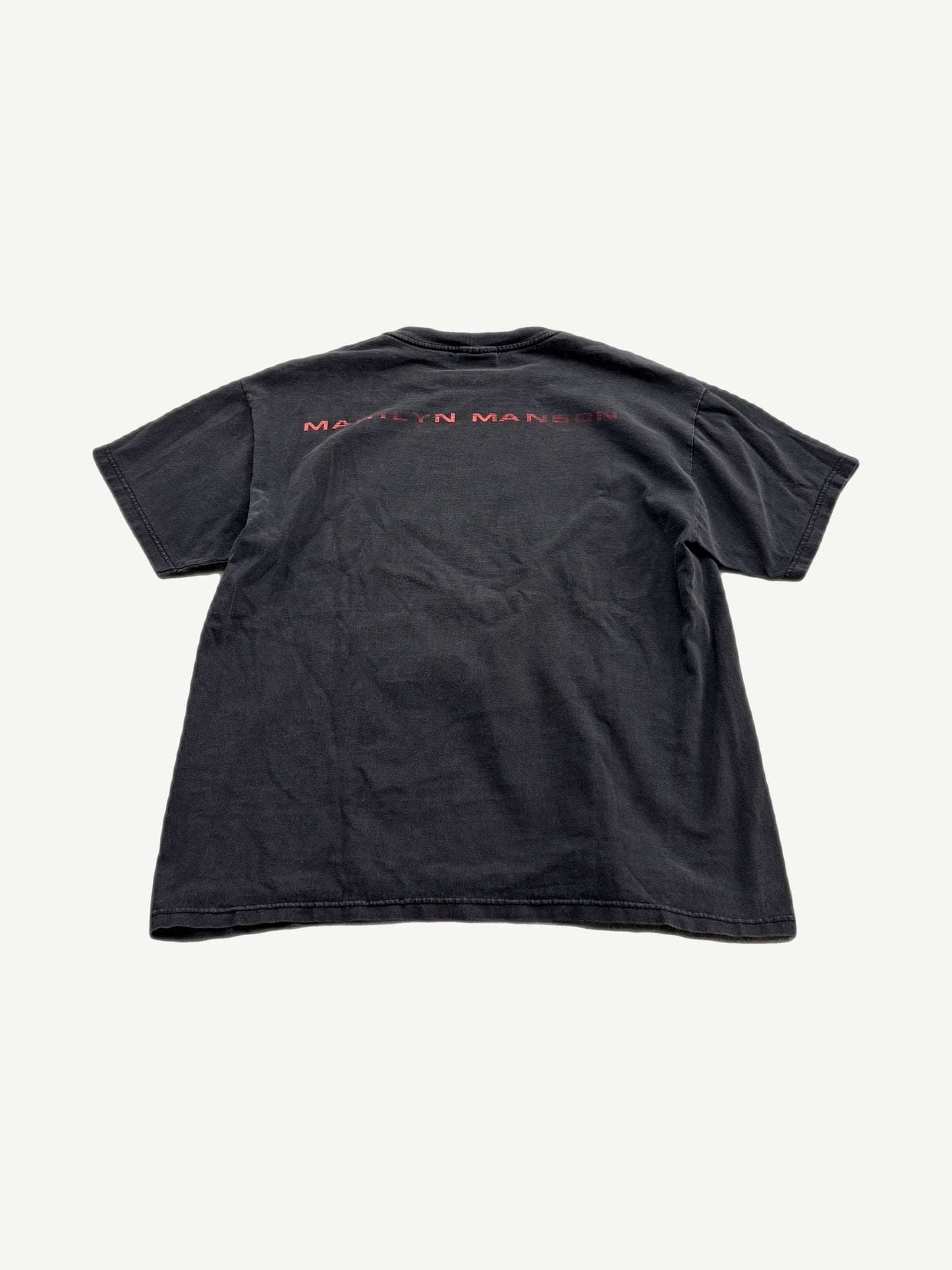 Vintage Marilyn Manson faded black tee back with red distressed band name print across shoulders.