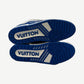 Louis Vuitton blue Trainer sneakers outsole view showing blue rubber sole with white Vuitton logo plate