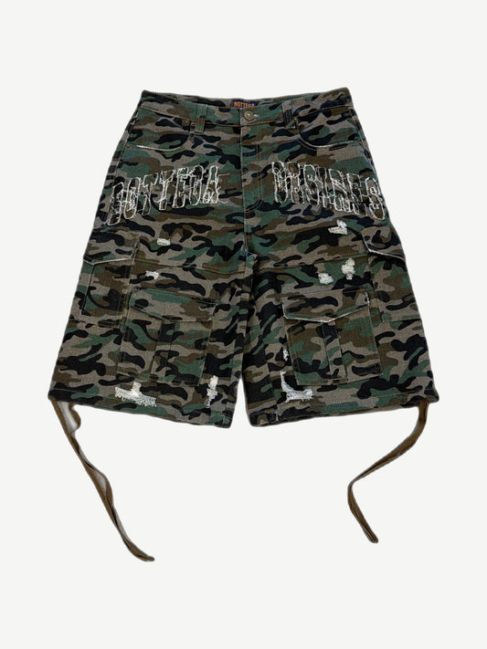 Bottega Desires green woodland camo distressed cargo shorts front view with side flap pockets and raw hem