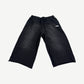 HMDD black Samurai 3/4 sweat shorts, knee-length jersey fleece with side pockets and elastic drawcord waist.