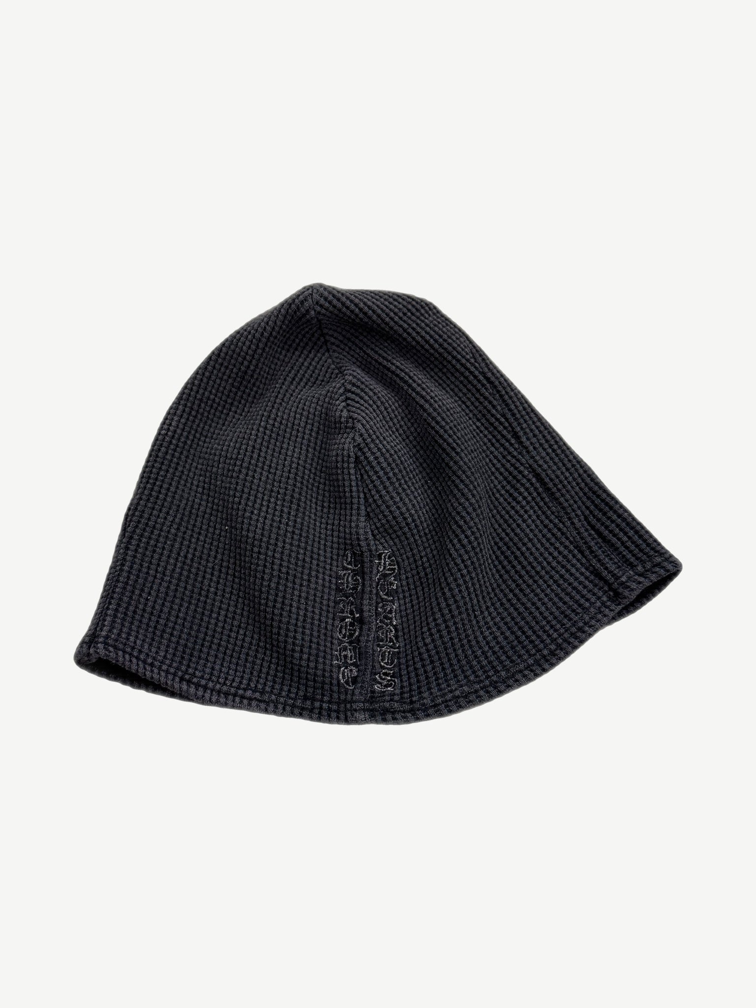 Vintage Chrome Hearts navy thermal beanie side view with tonal vertical Chrome Hearts logo embroidery.