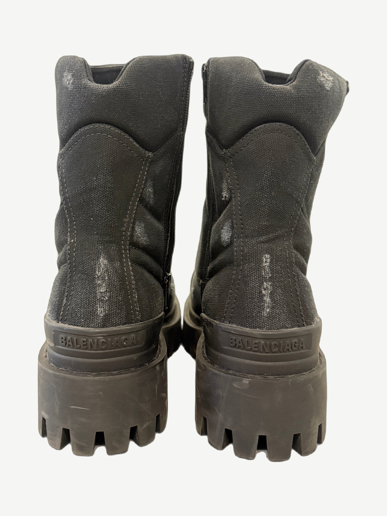 Balenciaga Combat Strike boot rear view with reinforced heel pull tab and debossed branding on chunky outsole.