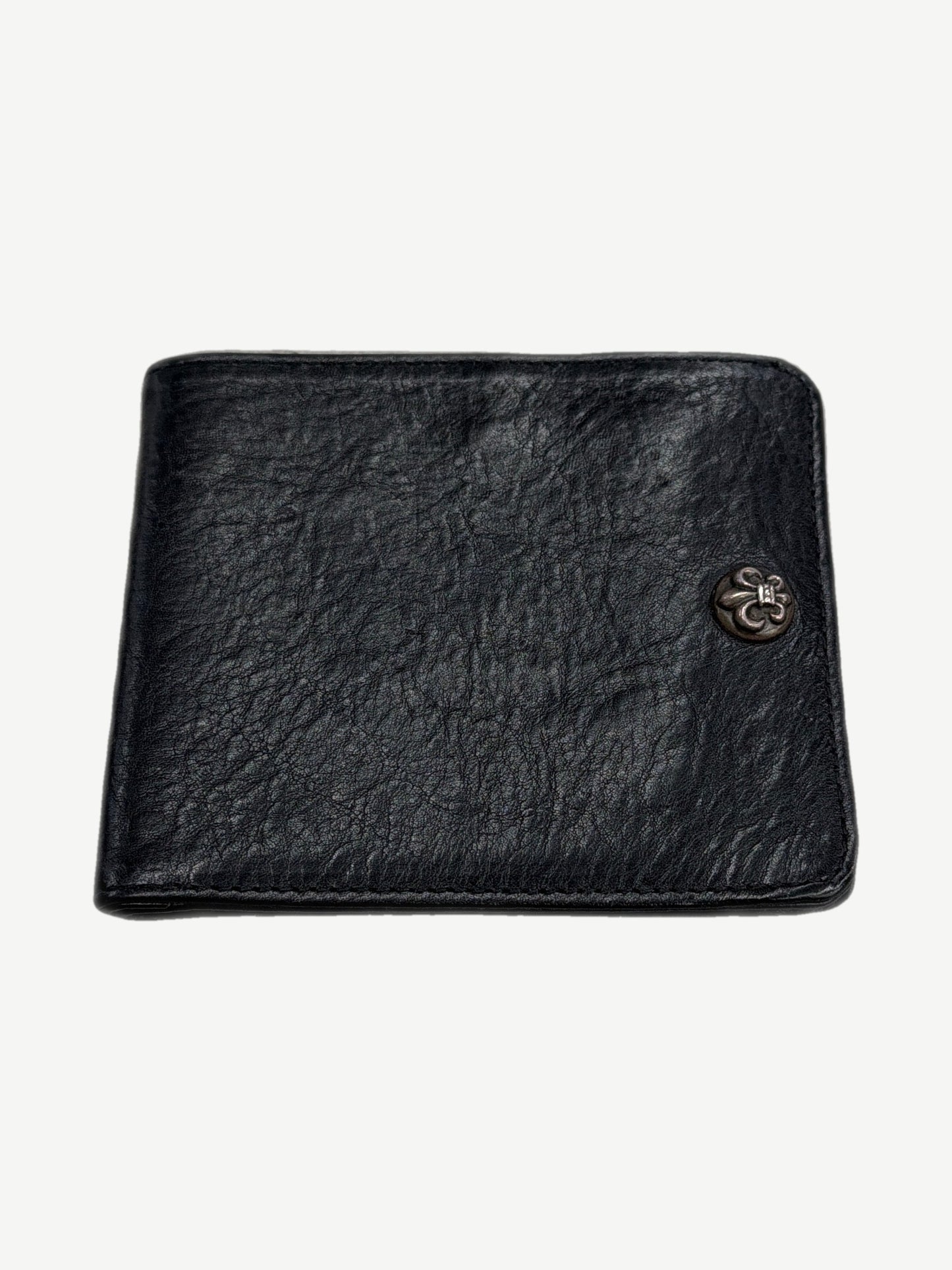 Chrome Hearts black leather bifold wallet front with sterling silver fleur de lis snap button accent