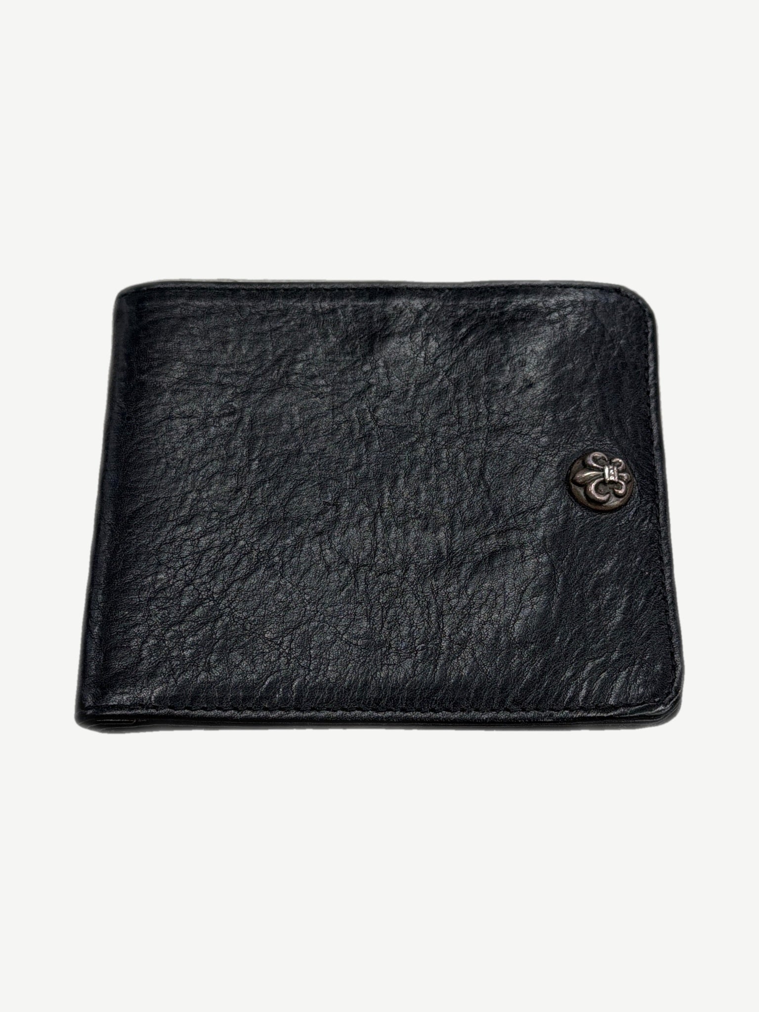 Chrome Hearts black leather bifold wallet front with sterling silver fleur de lis snap button accent