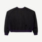 Raspberry Hills distressed black crewneck sweatshirt back view, blank panel with purple ribbed hem and scattered holes.