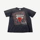 Vintage faded Chicago Bulls repeat logo tee in washed black with stacked Bulls wordmark print.