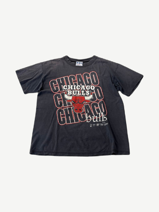 Vintage faded Chicago Bulls repeat logo tee in washed black with stacked Bulls wordmark print.