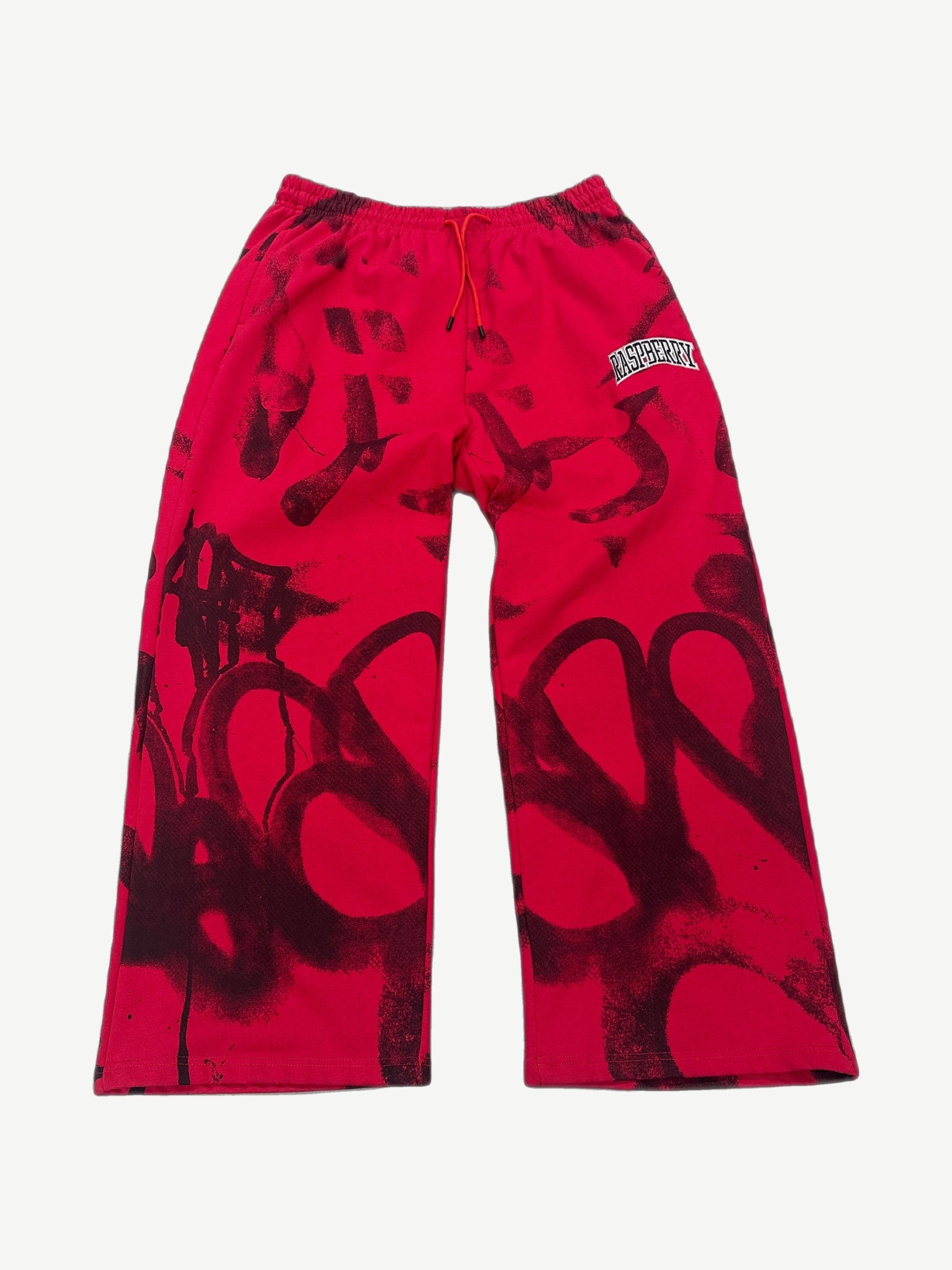 GV Gallery Raspberry Hills red sweatpants with dark graffiti pattern and arched Raspberry leg patch.