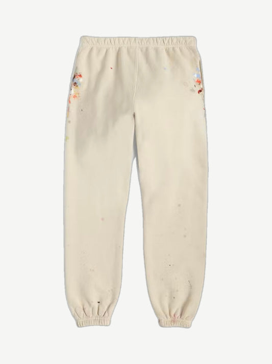 Gallery Dept cream painted logo sweatpants rear view with elastic waist and faded multicolor paint splatters