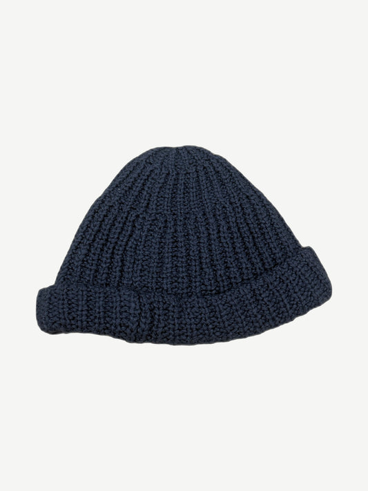 Back view of Paly Hollywood blue hand-knit beanie showing ribbed chunky cable texture and rolled cuff.