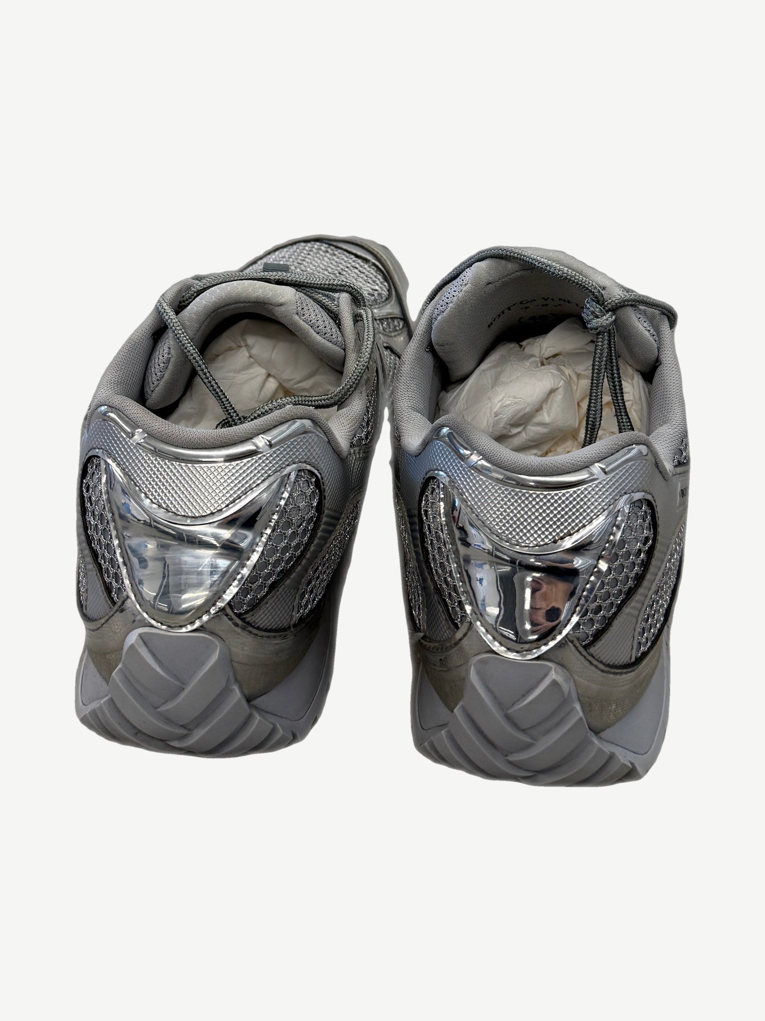 Bottega Veneta Orbit silver sneakers top down view showing tonal laces and reflective metallic overlays