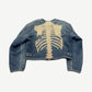 Kapital skeleton denim jacket, back view of full spine and ribs embroidery on faded indigo denim
