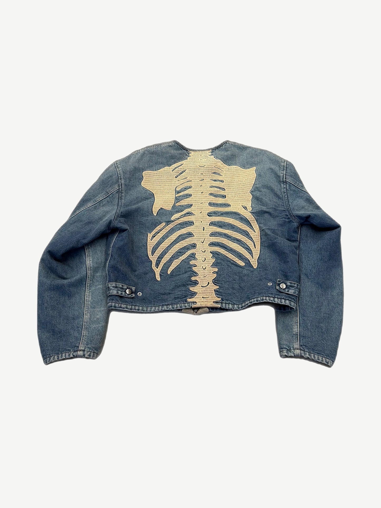Kapital skeleton denim jacket, back view of full spine and ribs embroidery on faded indigo denim