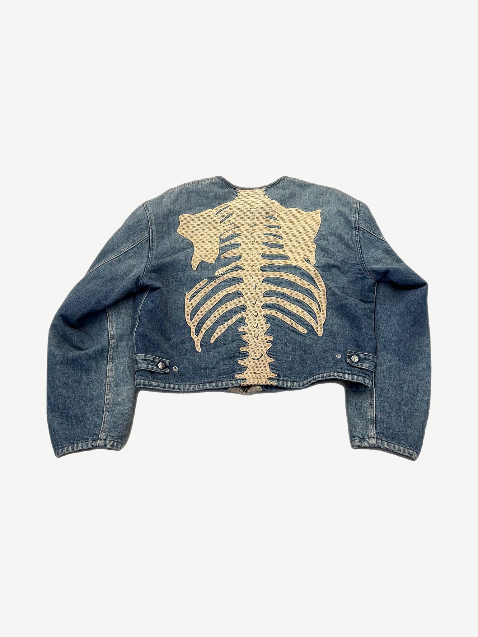 Kapital skeleton denim jacket, back view of full spine and ribs embroidery on faded indigo denim