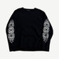 Chrome Hearts black cashmere crewneck sweater front view with white floral cross embroidery on both sleeves
