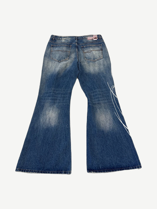 GV Gallery Raspberry Hills Miley Cyrus flare jeans front view, mid-rise blue denim with classic flare cut