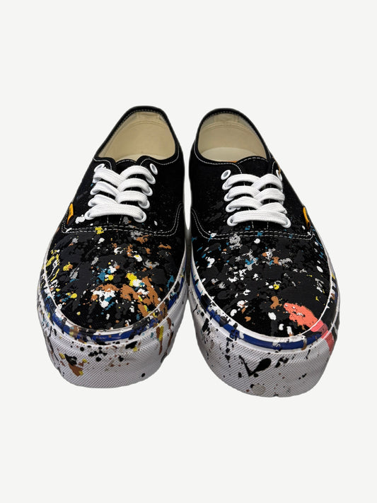 Gallery Dept Art That Kills Vans top view with multicolor paint splatter across black canvas uppers.