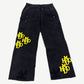 HMDD black carpenter pants back view with yellow contrast patches, hammer loop and double rear pockets