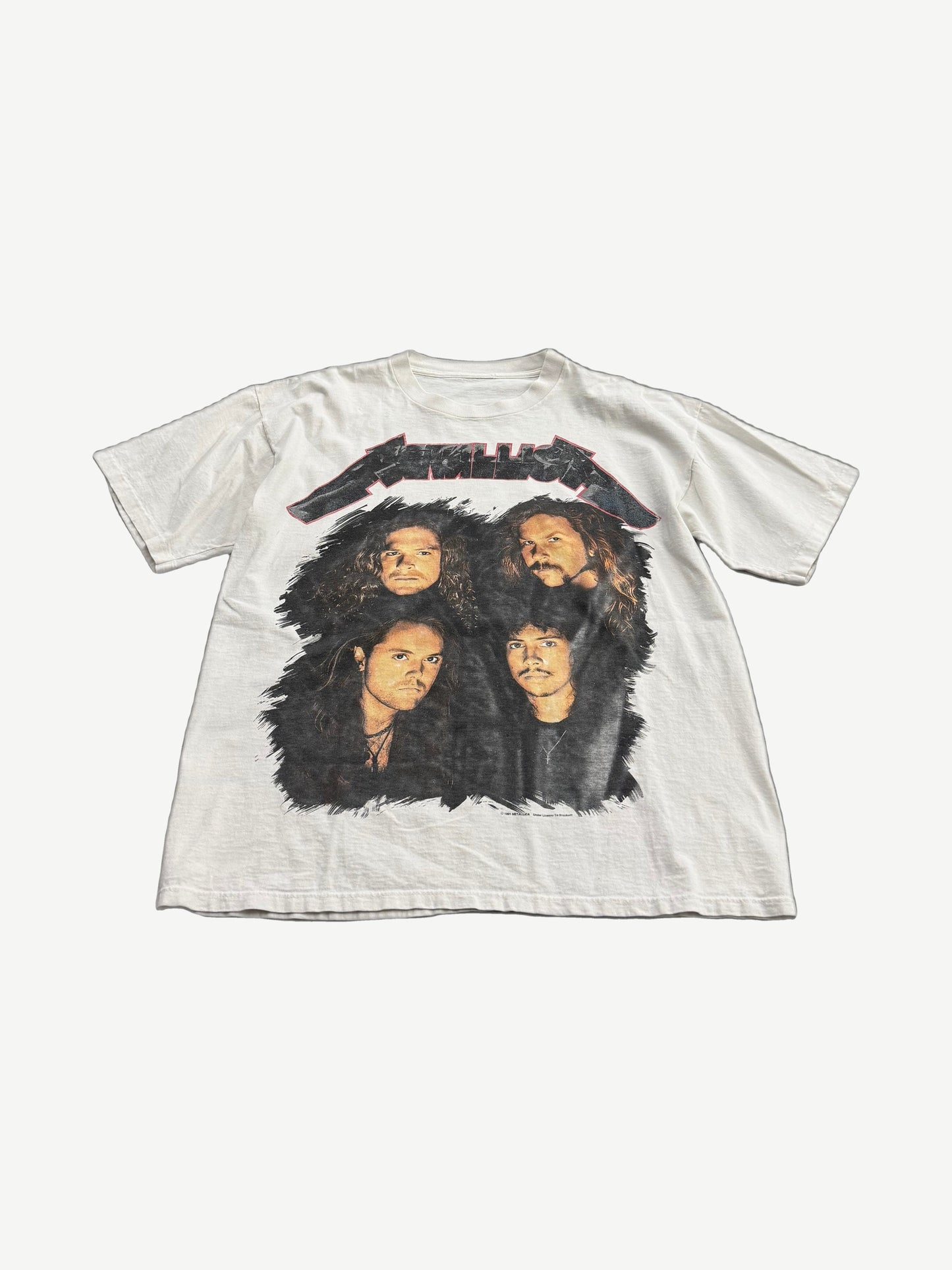 Vintage Metallica white tour tee front with four band member portraits beneath red and black Metallica logo print.