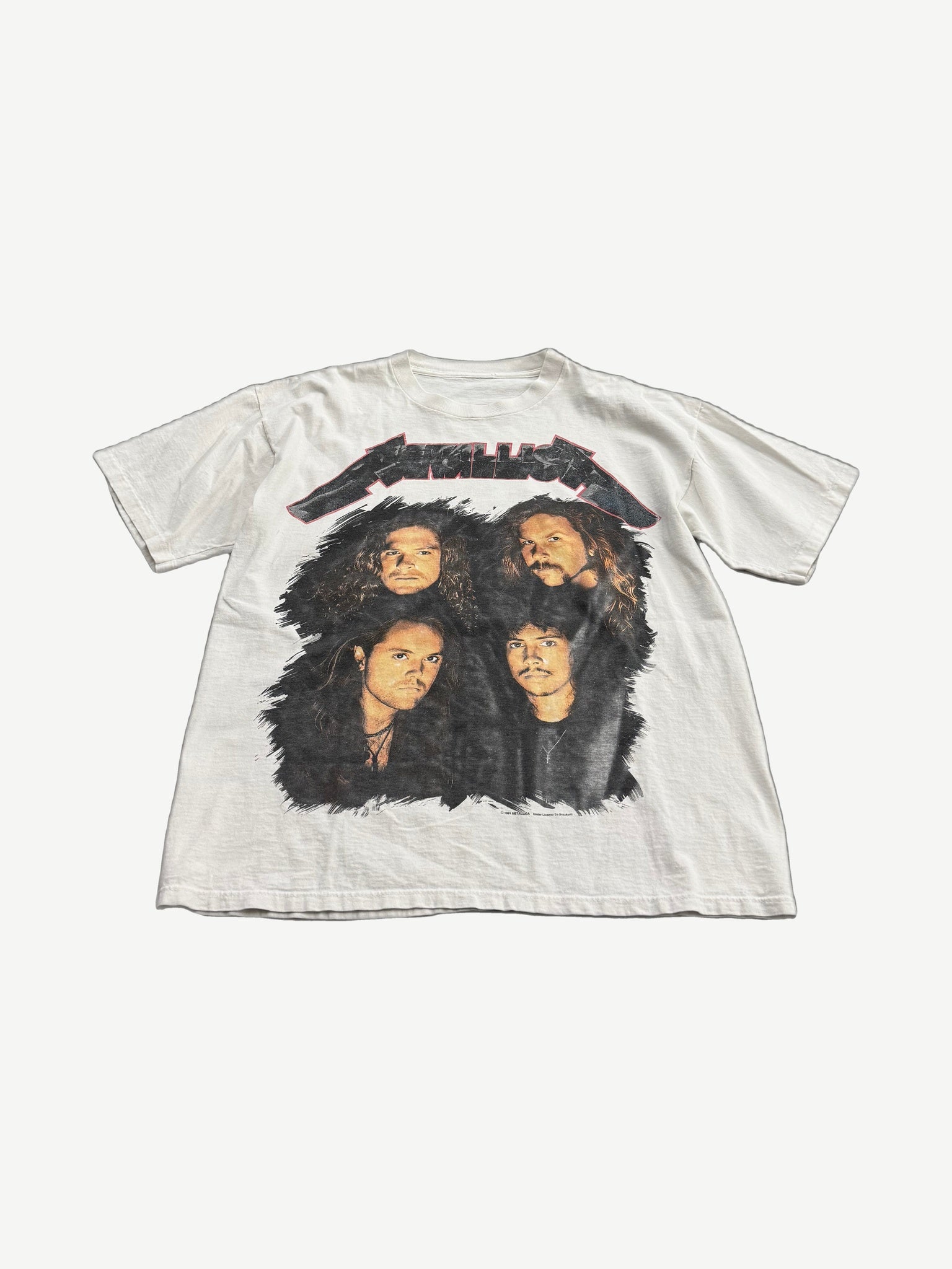 Vintage Metallica white tour tee front with four band member portraits beneath red and black Metallica logo print.
