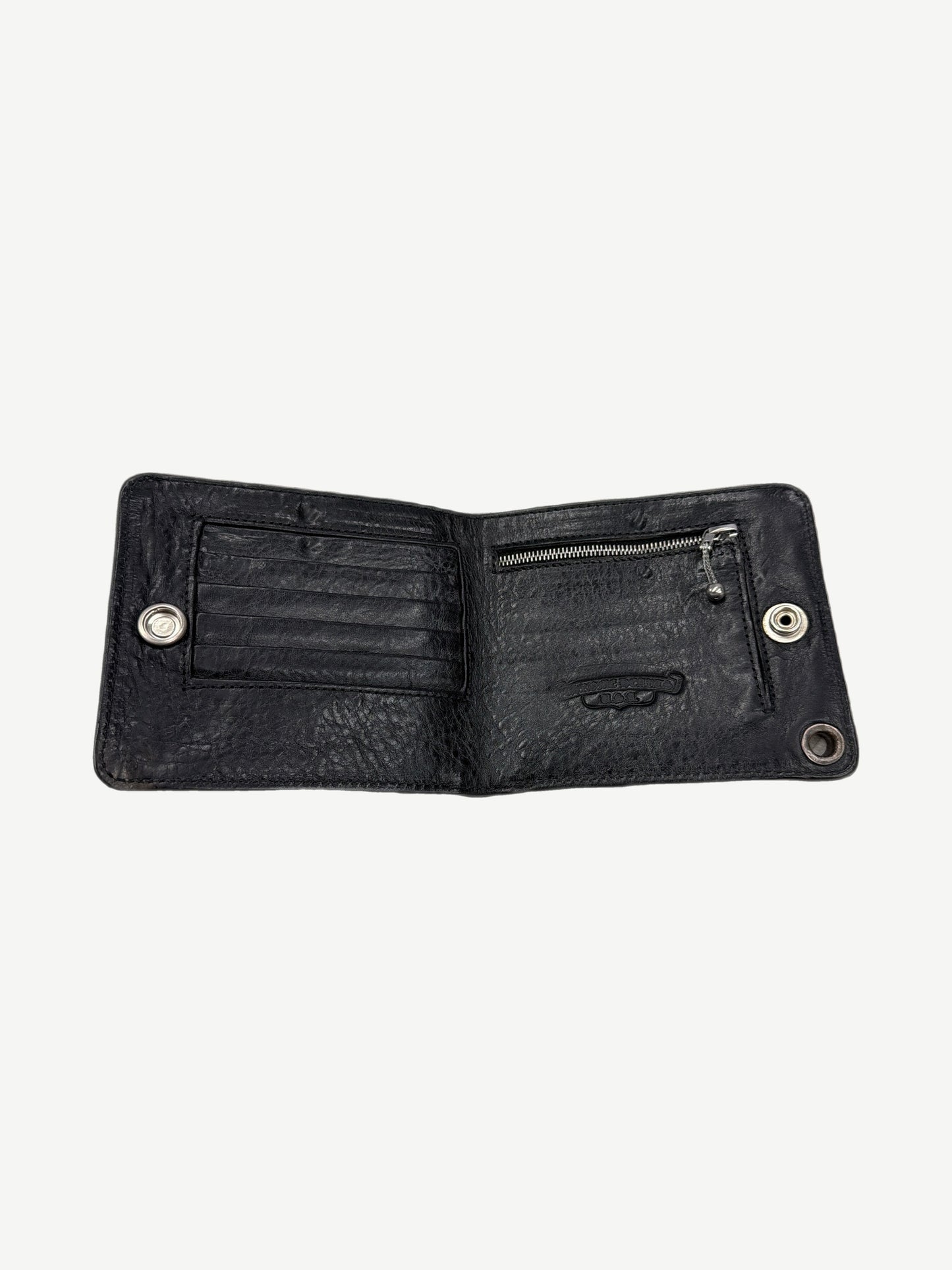 Chrome Hearts black leather wallet open interior with card slots, zip pocket and dual silver snap closures