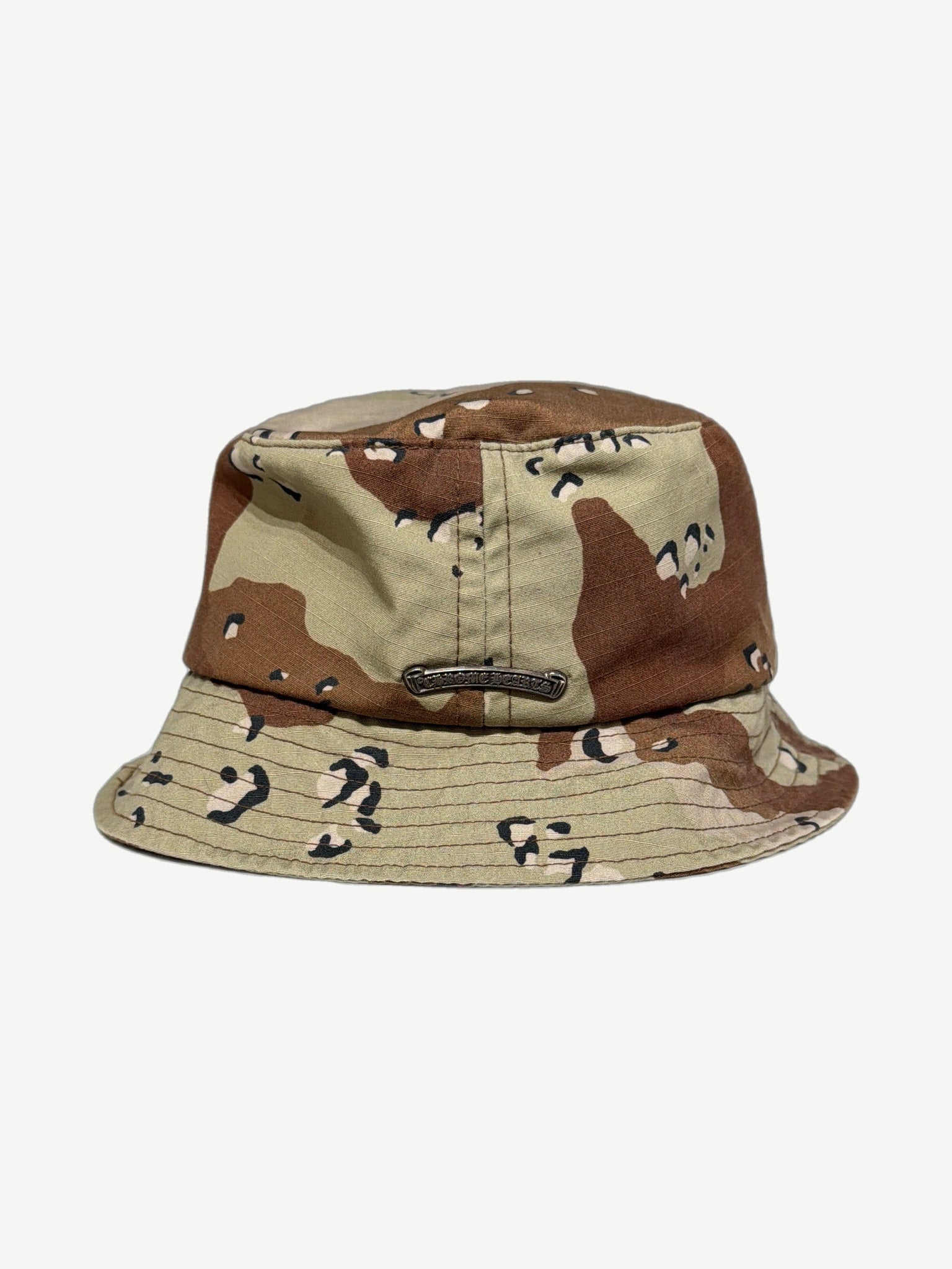 Chrome Hearts camo bucket hat back showing silver Chrome Hearts scroll plaque and chocolate chip camo print