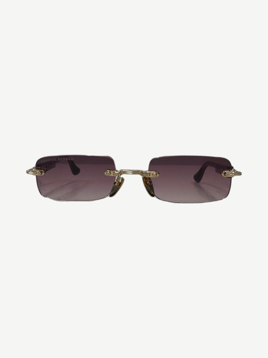 Chrome Hearts Wood Deep 1 rimless sunglasses front view with purple gradient lenses and gold chain-link bridge