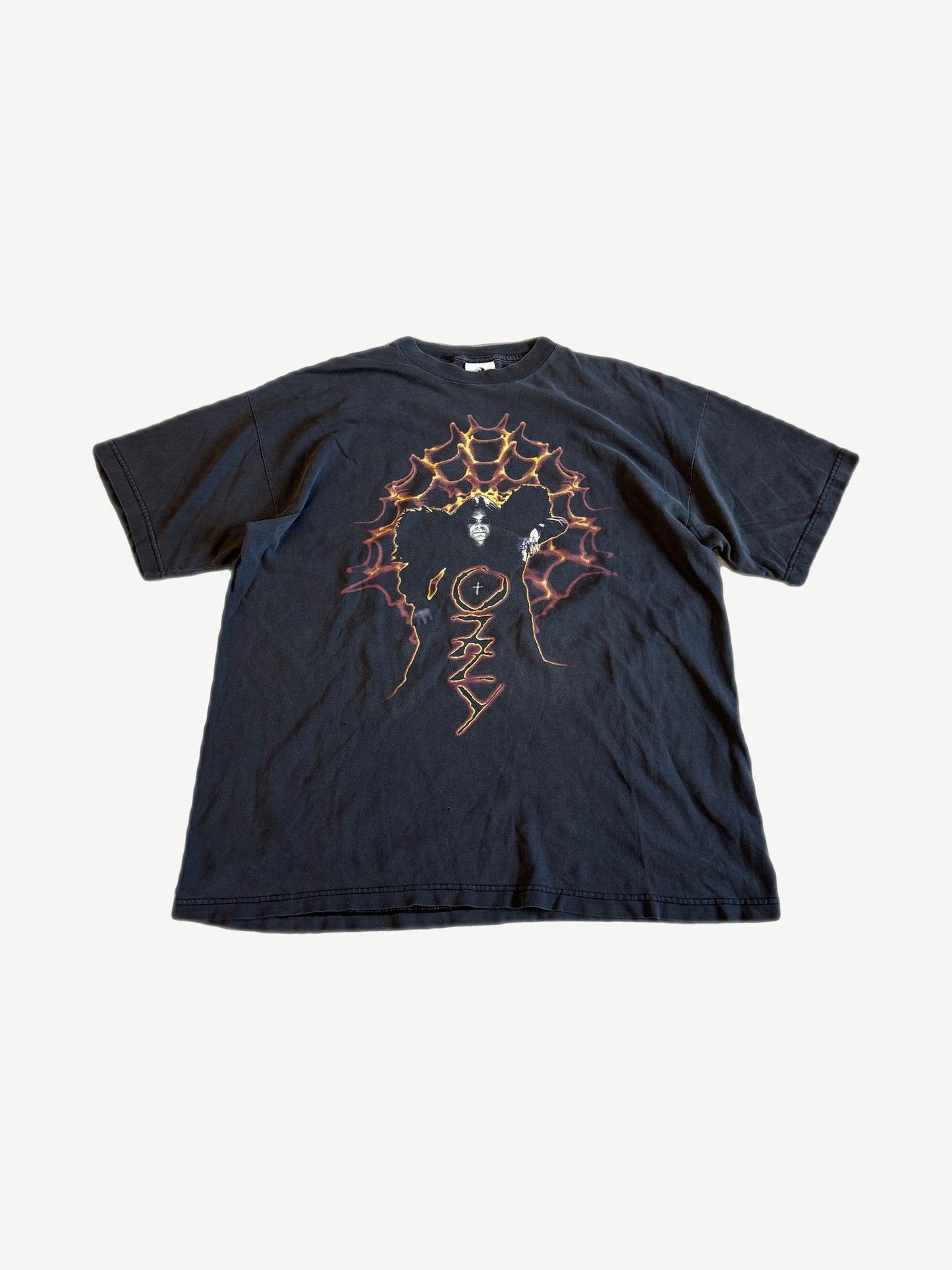 Vintage Ozzy Osbourne tee in faded black with orange flame spider web and Ozzy silhouette graphic.