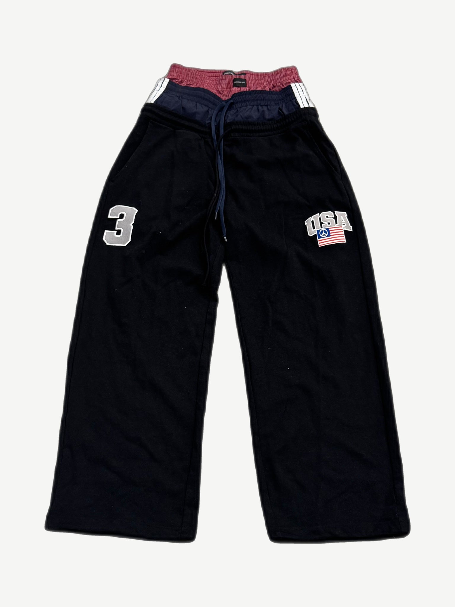 Project GR black triple layered sweatpants with stacked waistbands, USA peace flag patch and number 3 applique