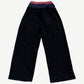 Back of Project GR black layered sweatpants showing triple stacked waistbands and patch pocket detail