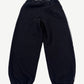 Raspberry Hills Berry black sweatpants back view showing exposed contrast stitching down inseam and elastic ankle cuffs.