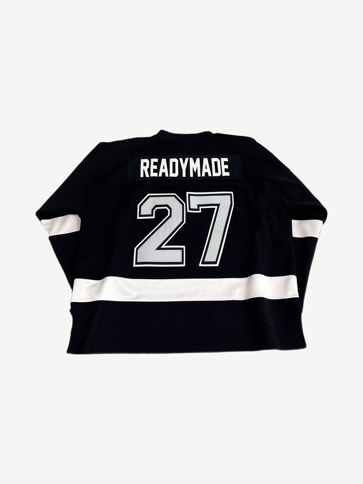 Readymade black hockey jersey back with READYMADE nameplate and large number 27 patch