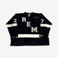 Readymade black hockey jersey front with REM letter applique, smile graphic and white sleeve stripes