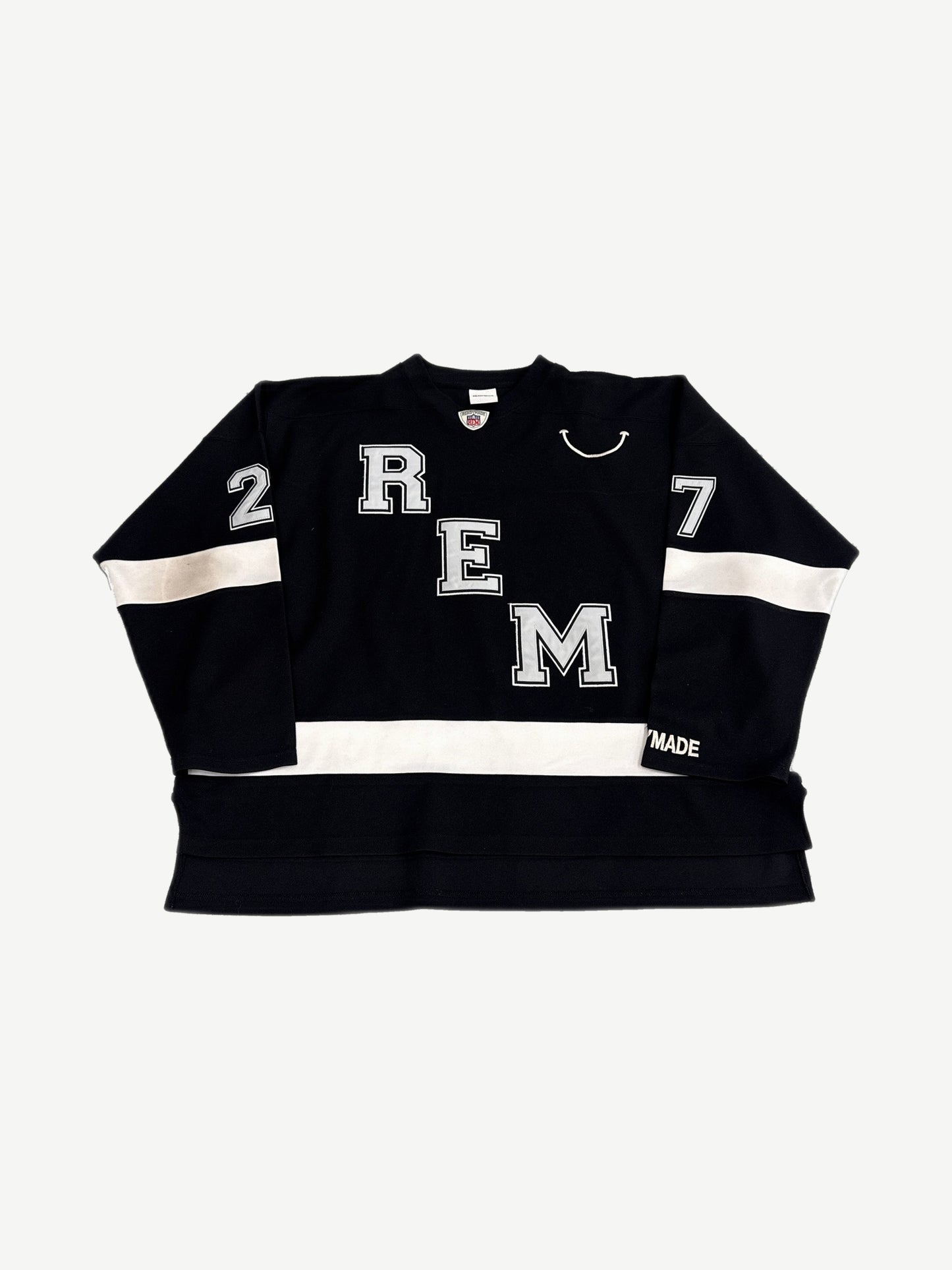 Readymade black hockey jersey front with REM letter applique, smile graphic and white sleeve stripes