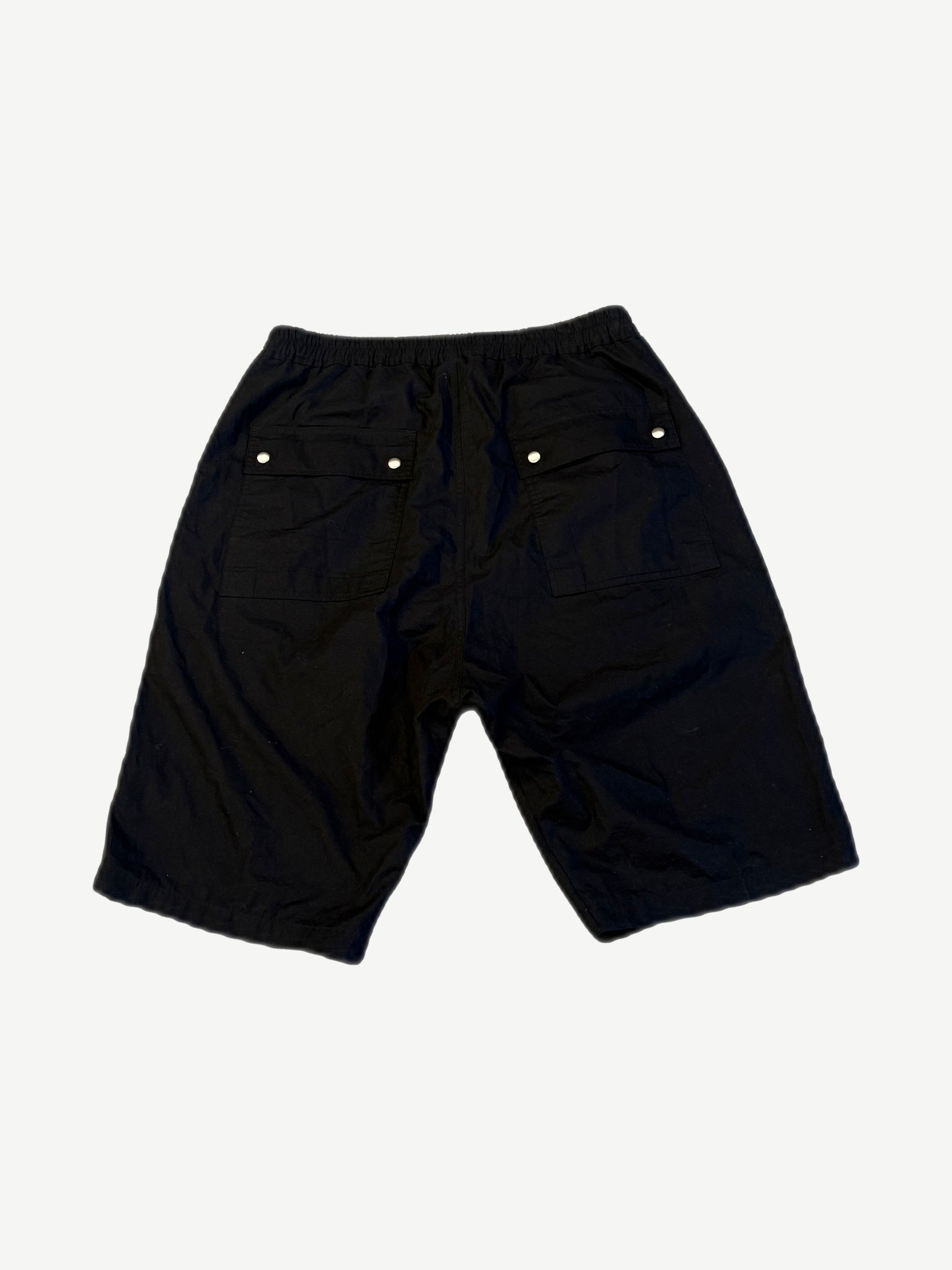 Rick Owens Bela Pods shorts back view in black cotton with twin flap pockets and snap closures.