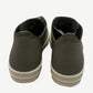 Back heel view of Rick Owens Hollywood low sneakers in celadon leather with center seam and cream platform sole