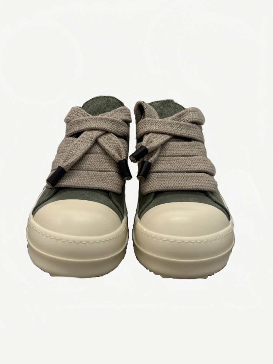 Rick Owens celadon suede sneaker front close up emphasizing oversized woven laces and cream toe cap