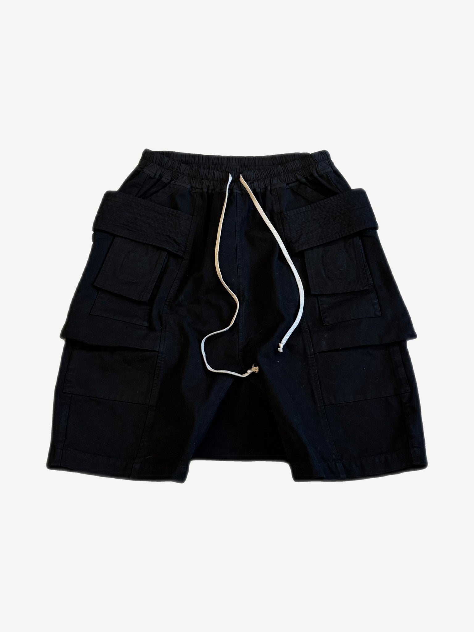 Rick Owens DRKSHDW Creatch cargo pod shorts in black cotton with oversized stacked flap pockets and drawstring.