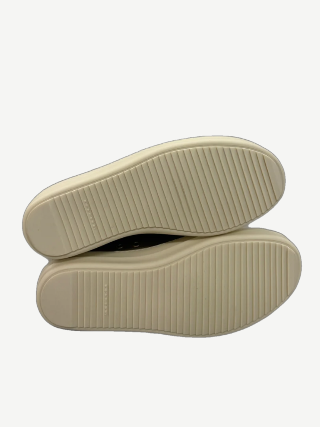 Cream rubber outsoles of Rick Owens DRKSHDW Jumbo Lace sneakers showing ridged tread pattern detail