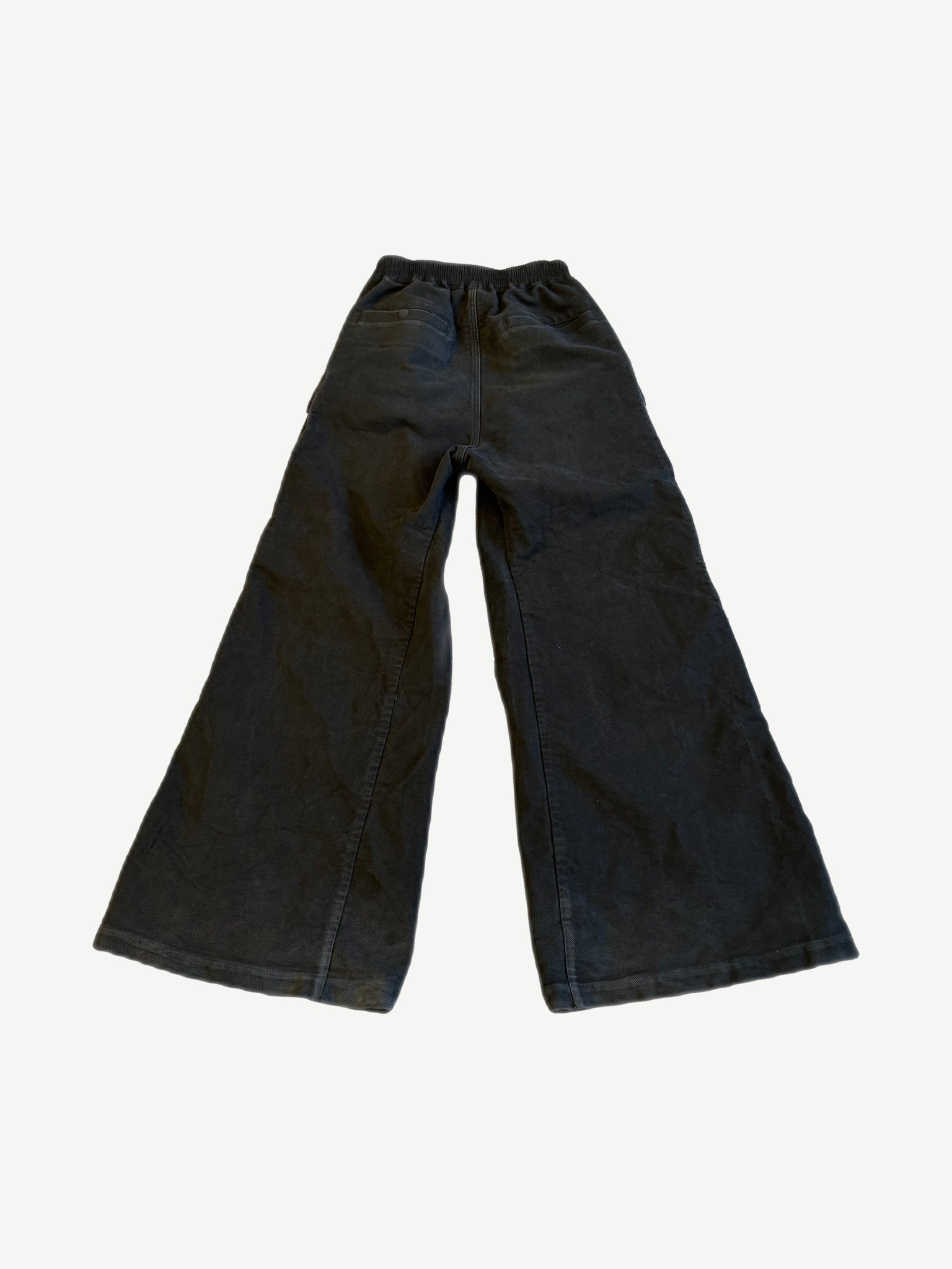 Rick Owens DRKSHDW forest black Bela cargo pants alternate angle showing oversized cargo flaps and raw hems