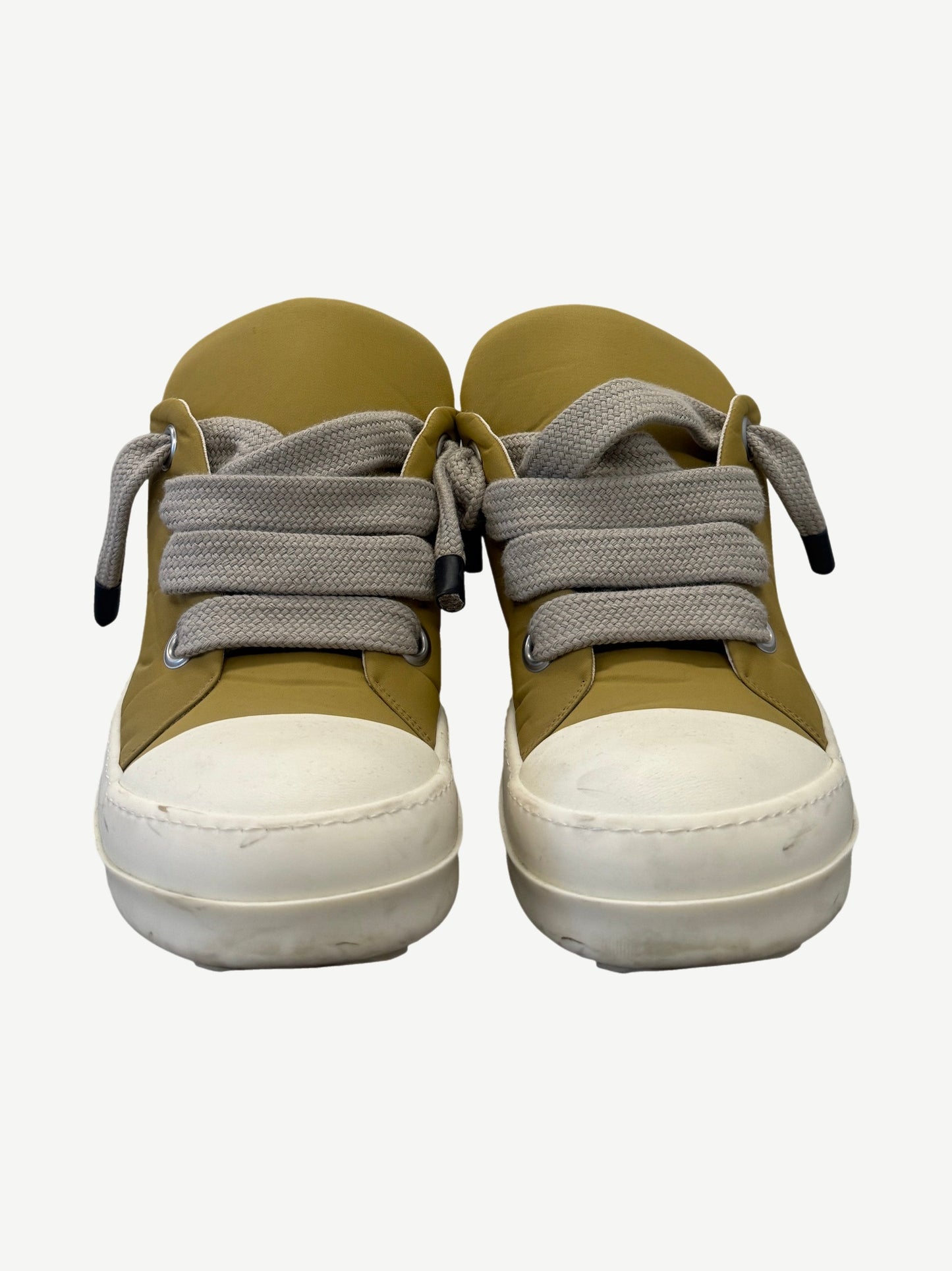 Rick Owens DRKSHDW mustard puffer low sneakers side view showing padded nylon upper and chunky white sole