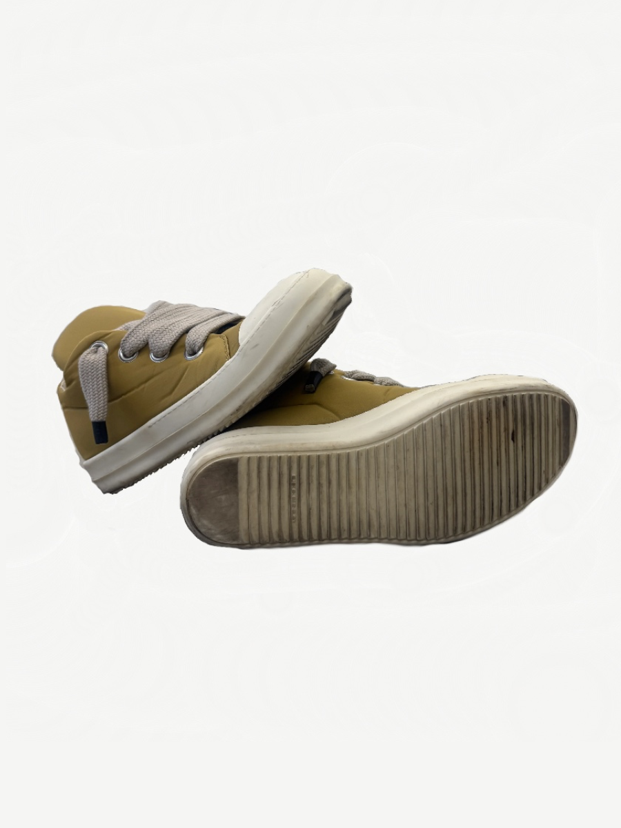 Rick Owens DRKSHDW mustard puffer sneakers top view with oversized woven jumbo laces through silver eyelets