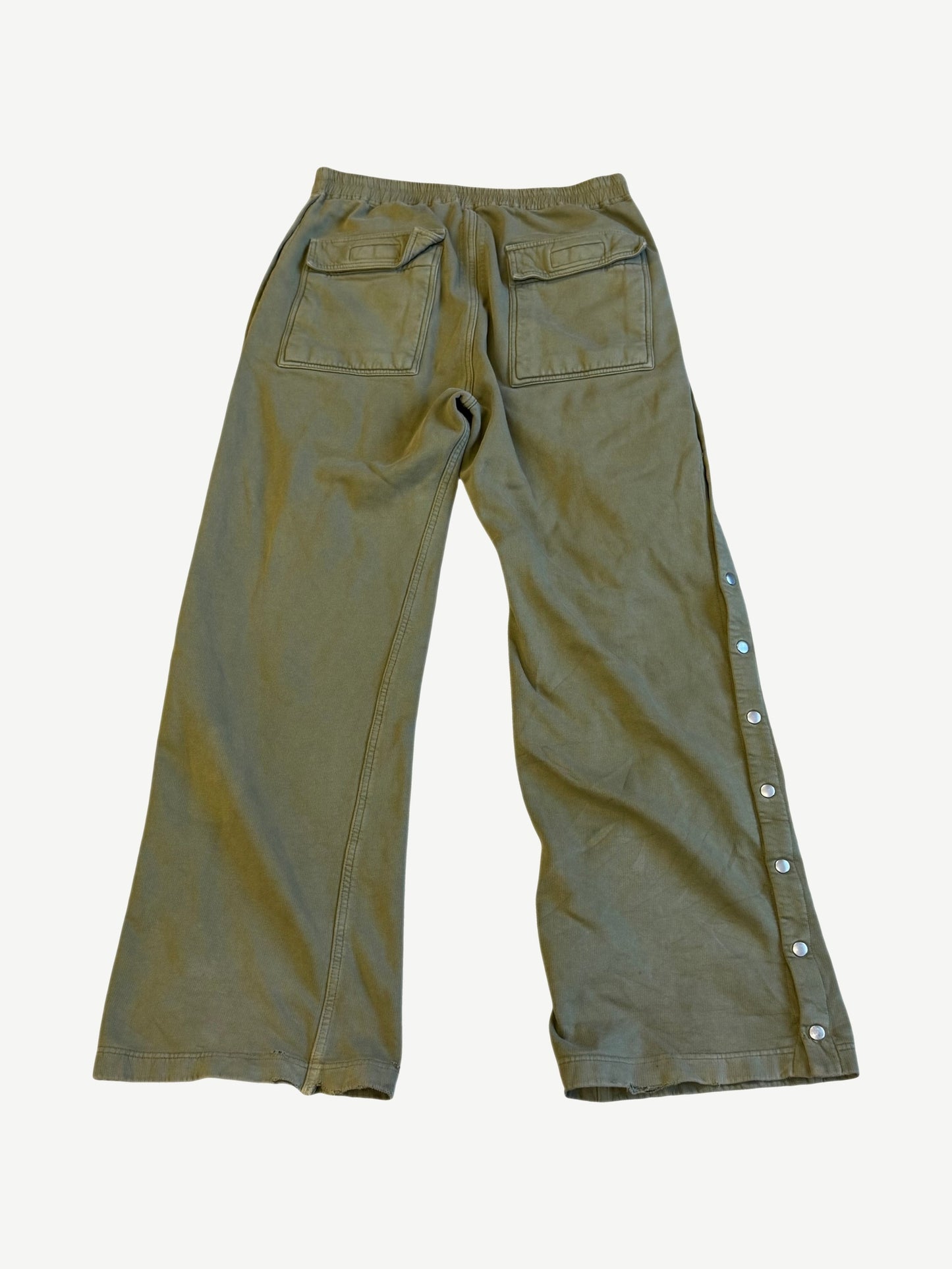 Back of Rick Owens DRKSHDW sage Pusher pants showing flap patch pockets and side popper button placket