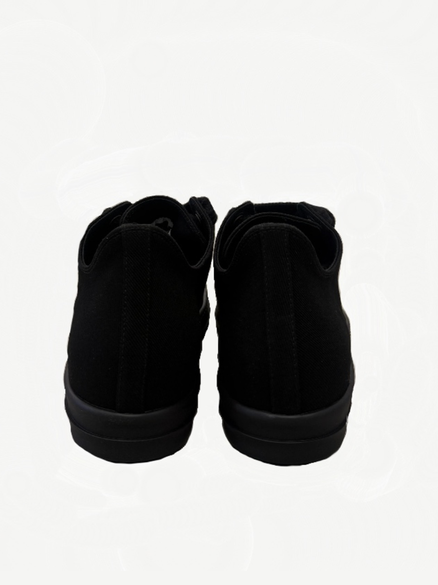 Rick Owens DRKSHDW triple black sneakers rear view showing canvas heel and black rubber midsole