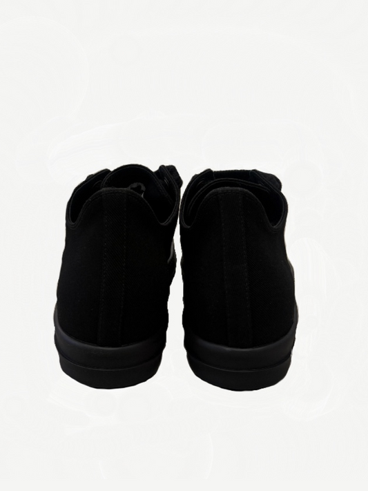 Rick Owens DRKSHDW triple black sneakers rear view showing canvas heel and black rubber midsole
