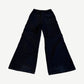 Back of Rick Owens Bela dark canvas cargo pants showing wide flared leg and welt rear pocket detail.
