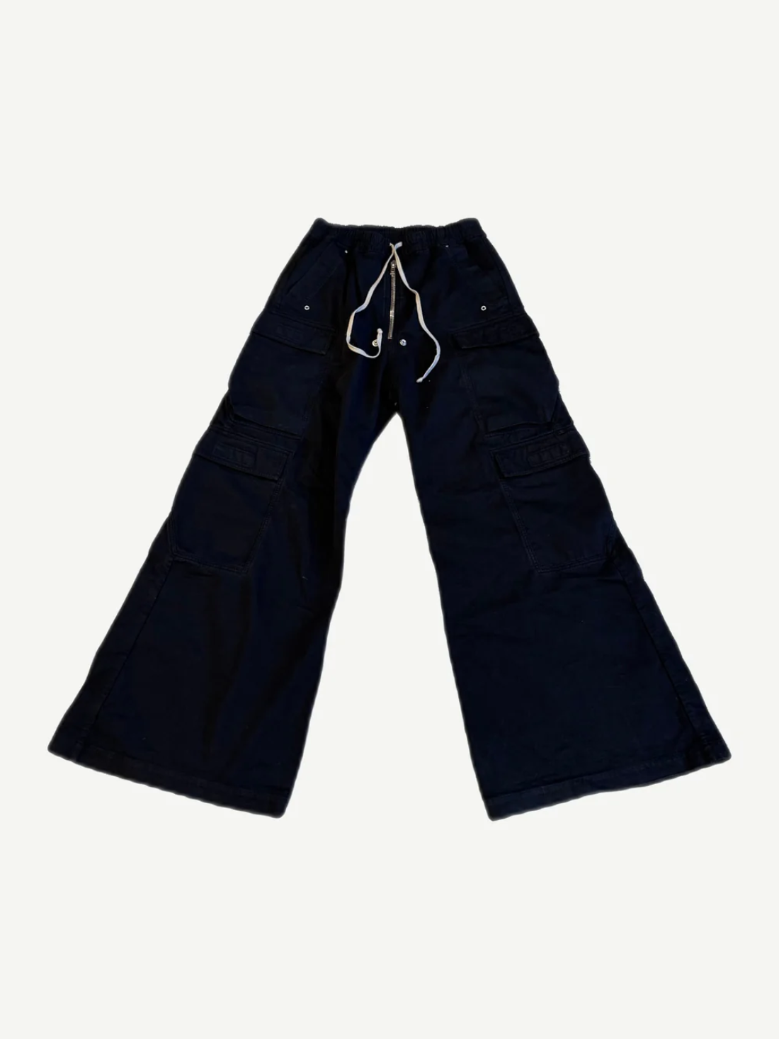 Rick Owens Bela cargo pants in dark navy canvas with drawstring waist, wide leg flare and side pockets.