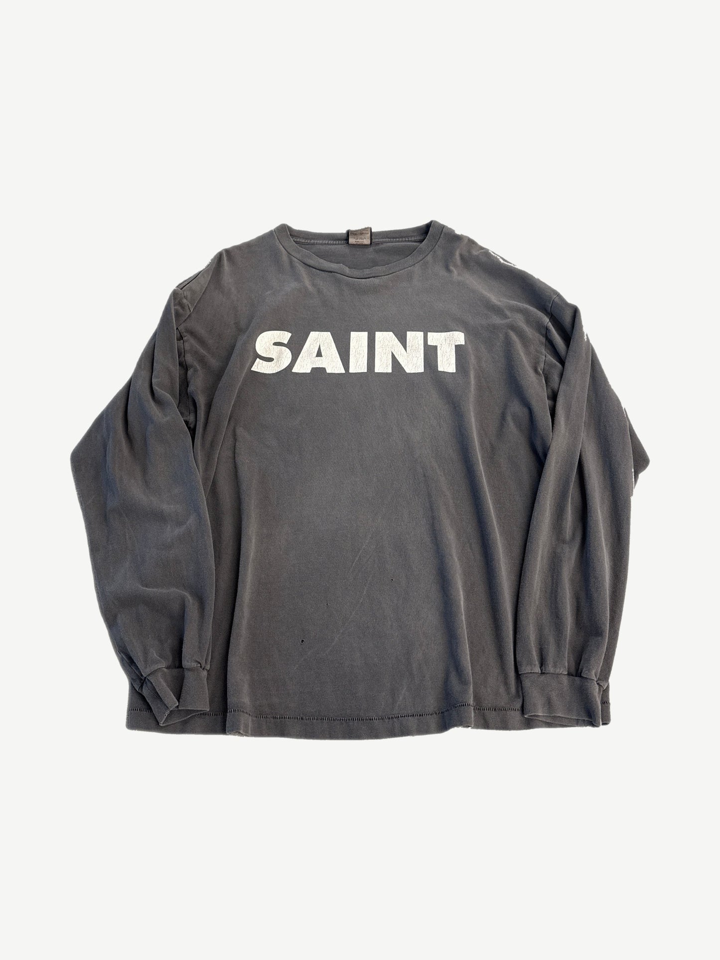 Saint Michael gray long sleeve tee with bold black SNT logo across the chest, ribbed crew neck and cuffs.