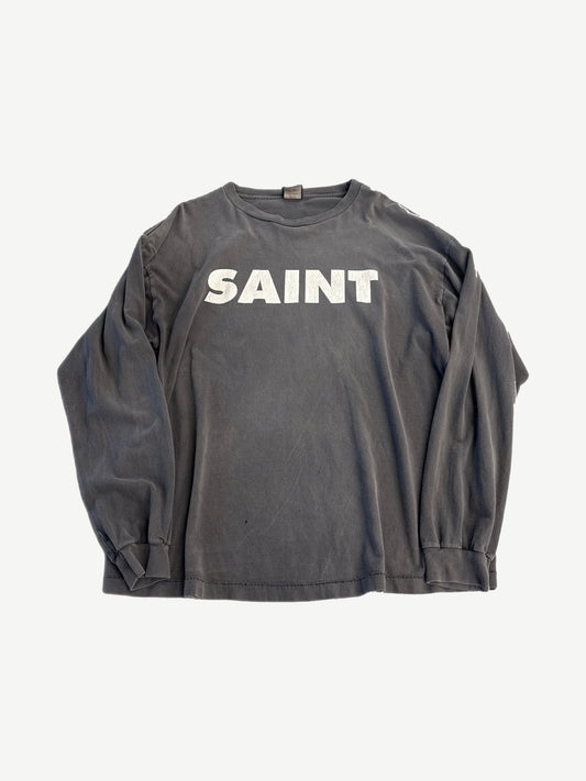 Saint Michael gray long sleeve tee with bold black SNT logo across the chest, ribbed crew neck and cuffs.